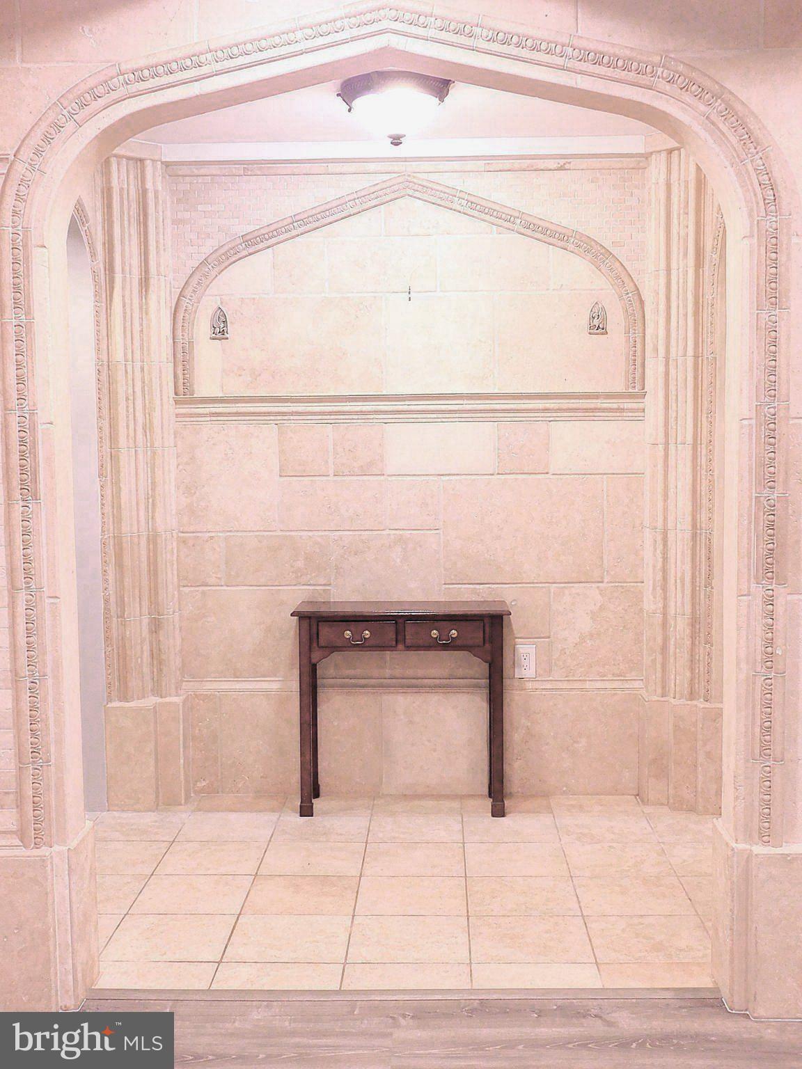 2241 Cartwright Place Reston, VA 20191 - Photo 8 of 40 Foyer with custom Travertine inset stone arch