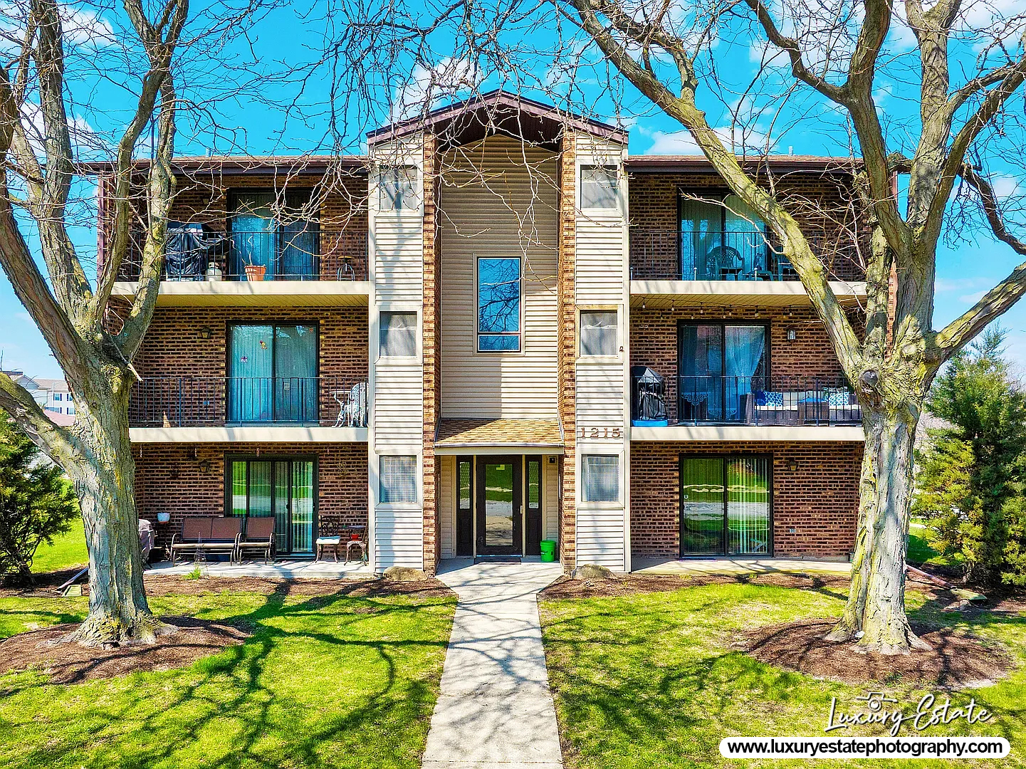 1215 Chalet Road, Unit 200 Naperville, IL 60563 - Photo 1 of 15 a view of a house with sitting area and garden