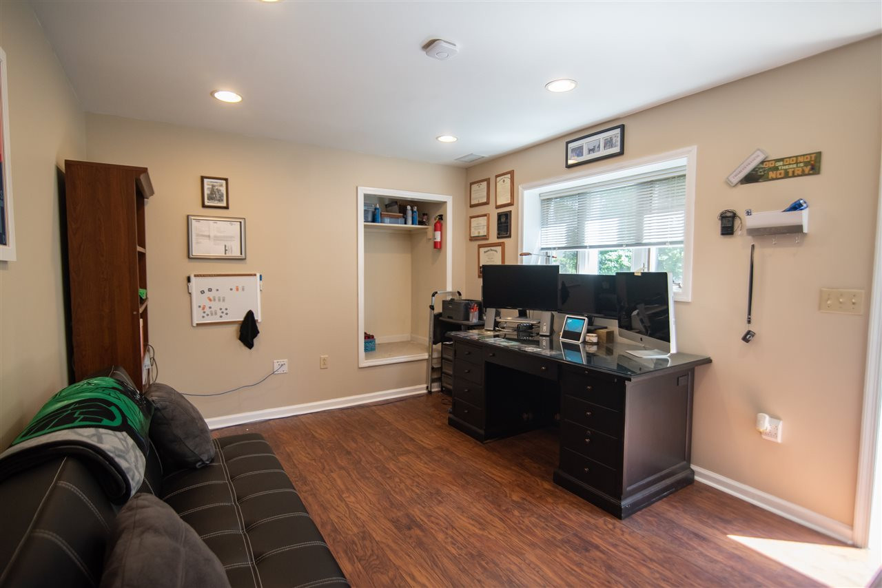 9720 Talman Court Raleigh, NC 27615 - Photo 25 of 30 Basement office/flexroom accessible from the exterior. Studio/Study/Office