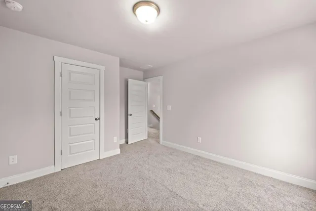 an empty room with closet area