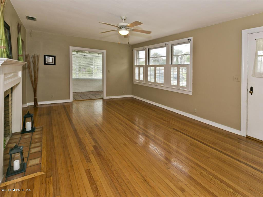 4030 Dover Road Jacksonville, FL 32207 - Photo 4 of 21 wooden floor in an empty room with a window