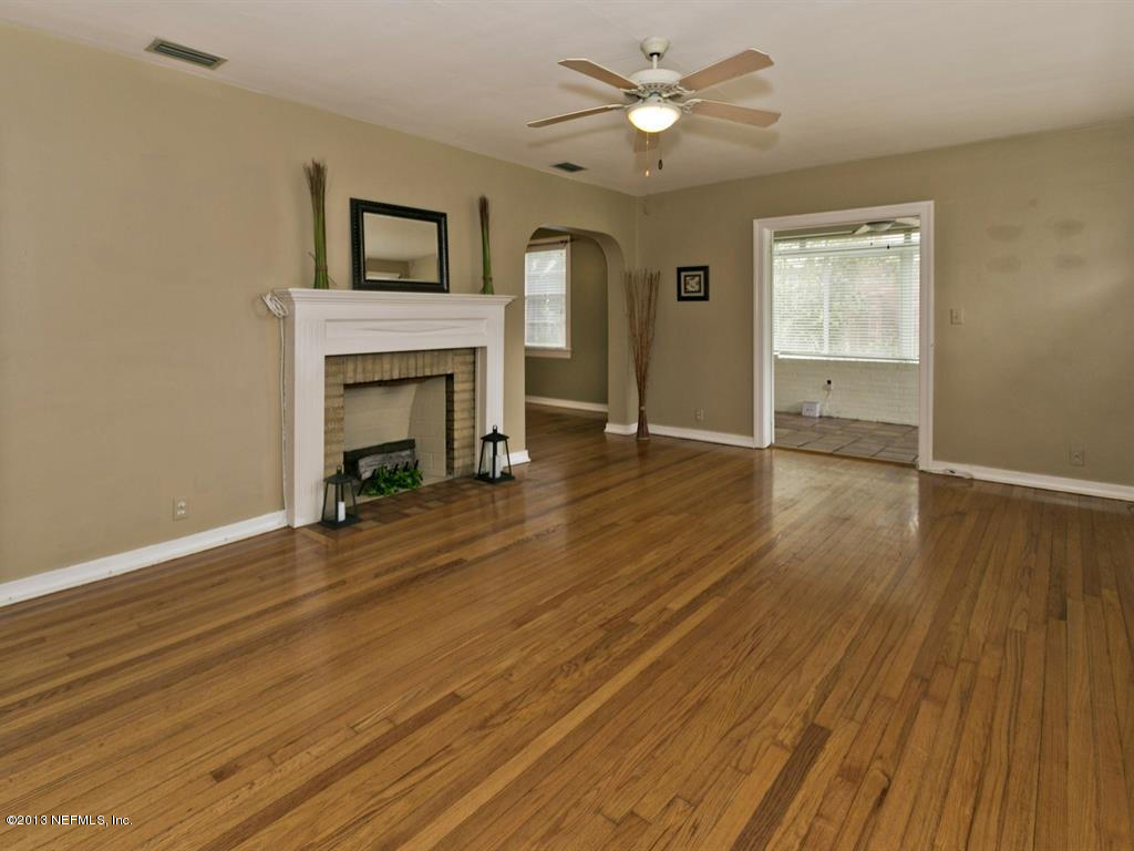 4030 Dover Road Jacksonville, FL 32207 - Photo 5 of 21 a view of empty room with wooden floor and fan