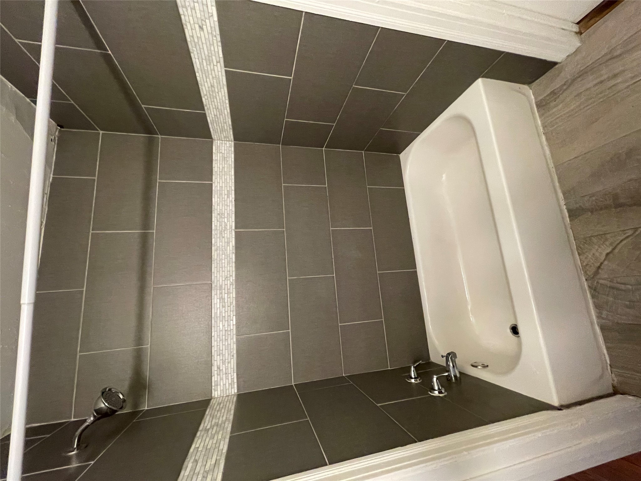 819 East 31st Street Austin, TX 78705 - Photo 16 of 19 a bathroom with a white bath tub and a shower