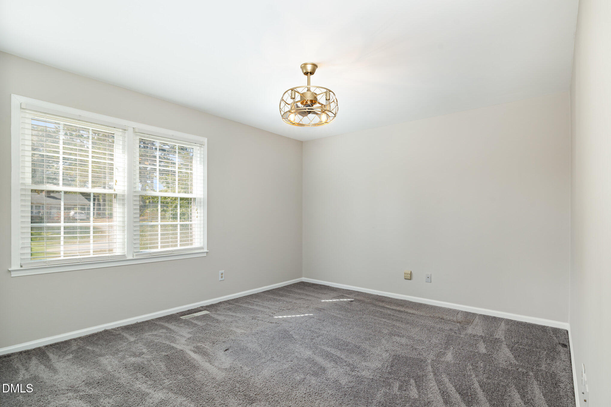 414 Aquilla Road Benson, NC 27504 - Photo 11 of 30 an empty room with a window