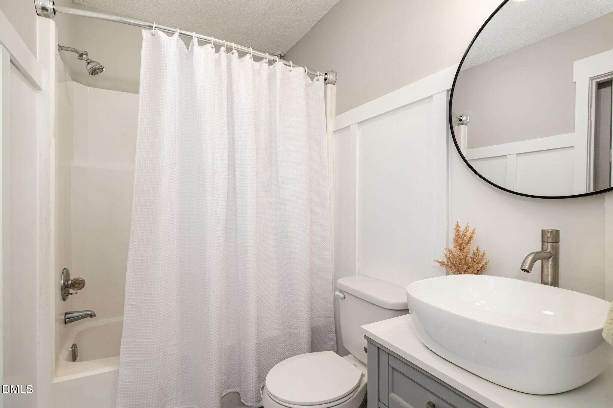 414 Aquilla Road Benson, NC 27504 - Photo 13 of 30 a white toilet sitting next to a bathroom sink