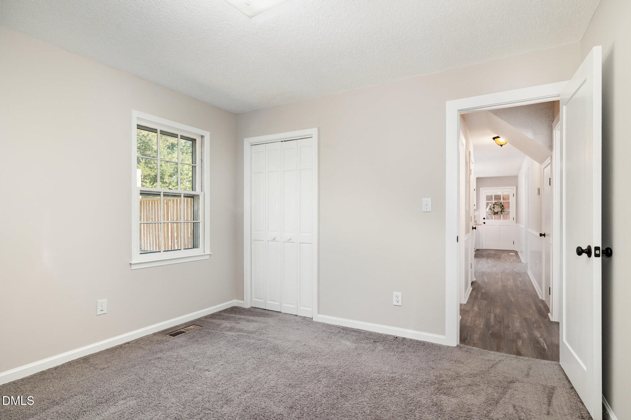 414 Aquilla Road Benson, NC 27504 - Photo 14 of 30 an empty room with windows and closet