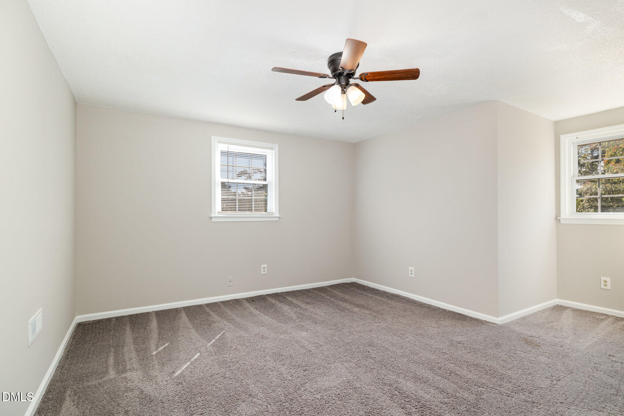414 Aquilla Road Benson, NC 27504 - Photo 17 of 30 a view of a big room with carpet