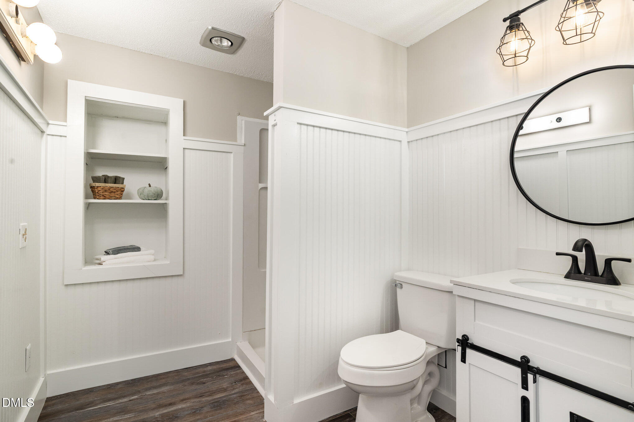 414 Aquilla Road Benson, NC 27504 - Photo 20 of 30 a bathroom with a toilet sink and mirror