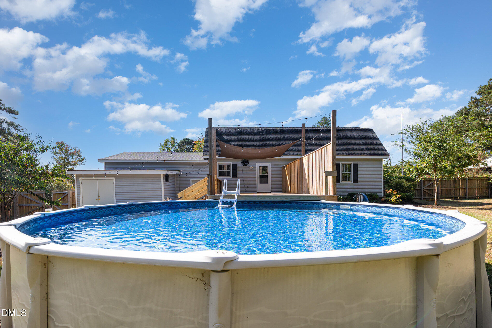 414 Aquilla Road Benson, NC 27504 - Photo 22 of 30 a view of a house with pool and chairs