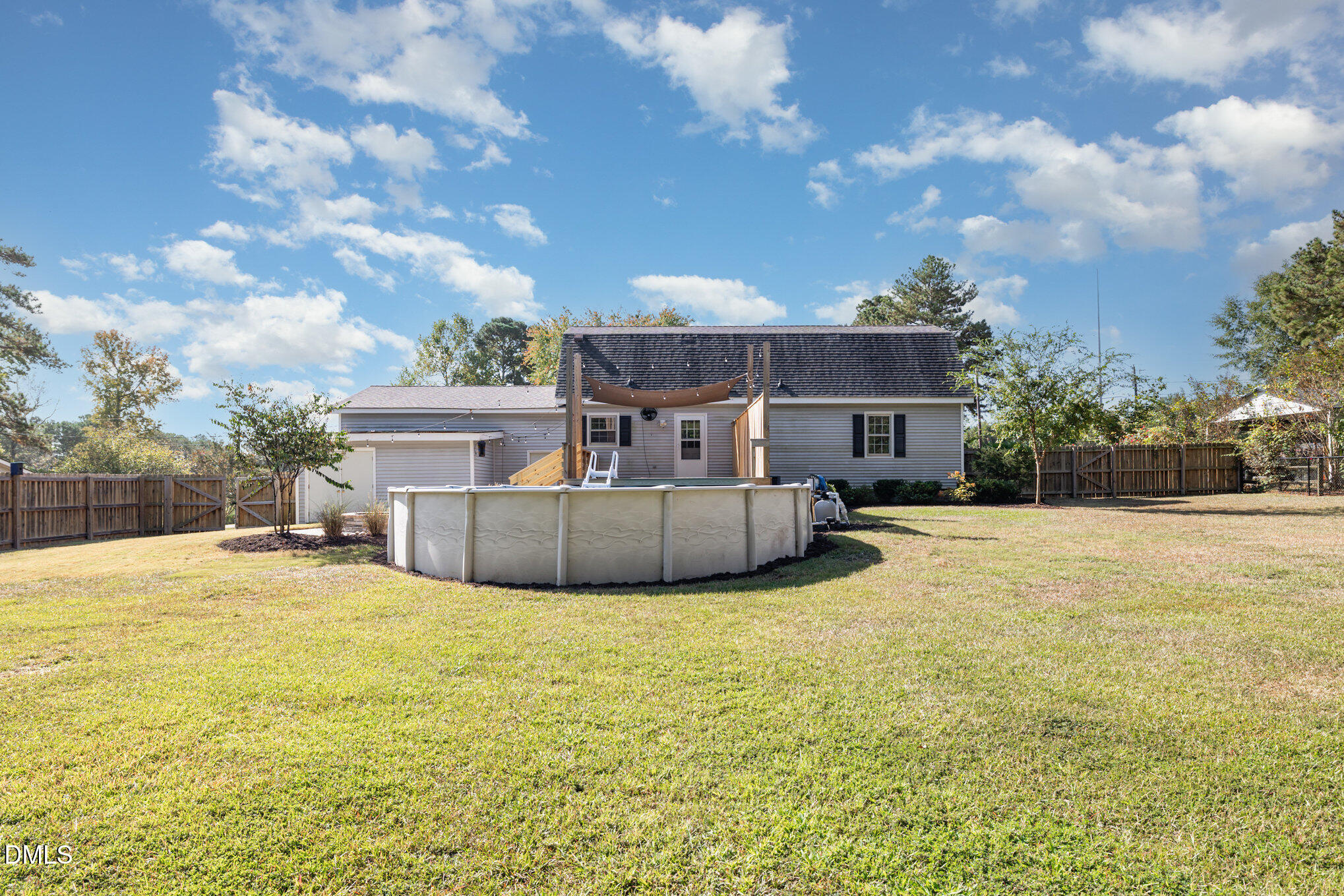 414 Aquilla Road Benson, NC 27504 - Photo 25 of 30 a view of a house with a yard and sitting area