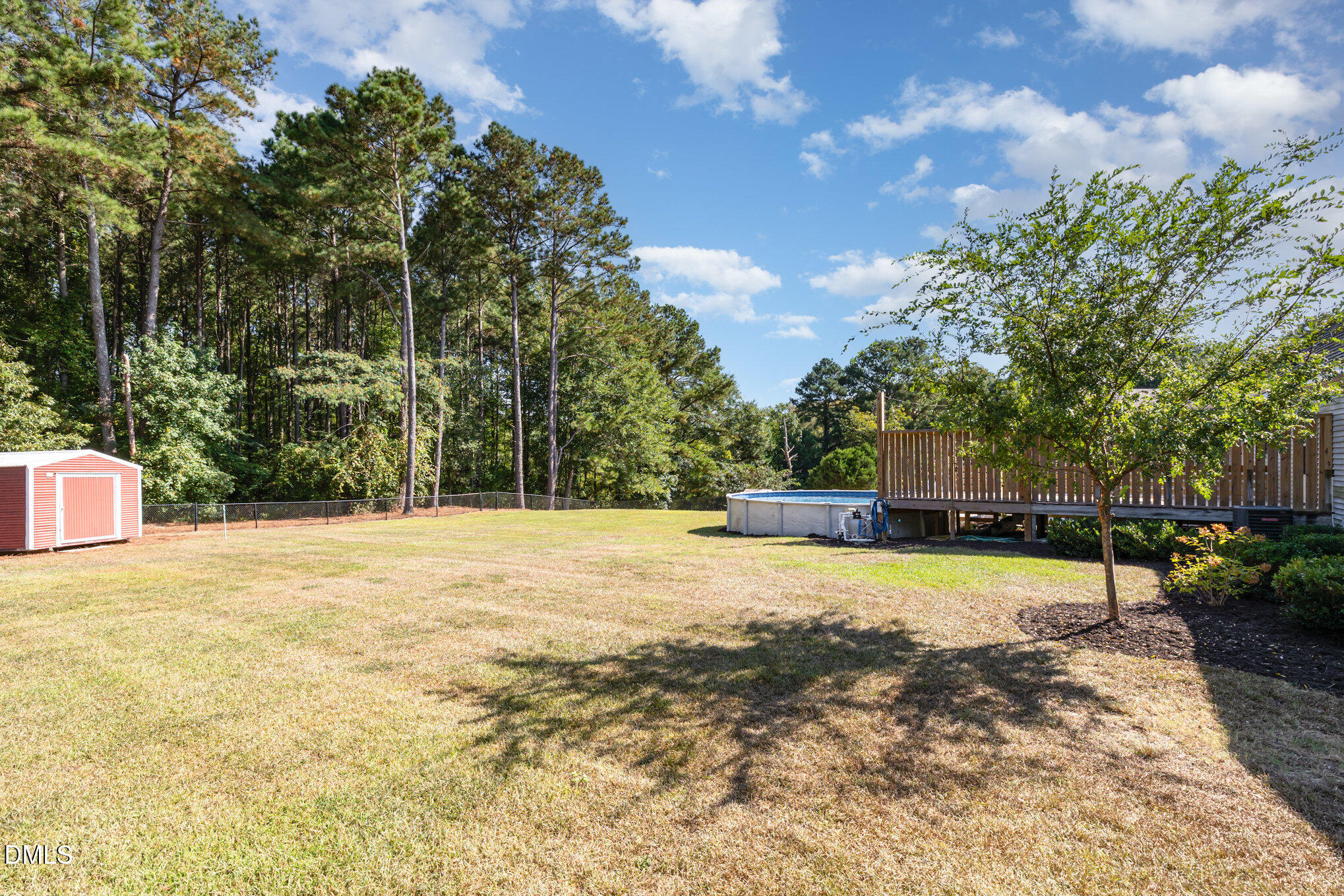 414 Aquilla Road Benson, NC 27504 - Photo 27 of 30 a view of a swimming pool with a yard