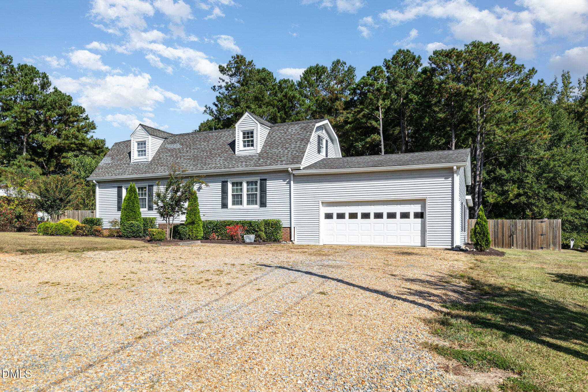 414 Aquilla Road Benson, NC 27504 - Photo 4 of 30 a view of a house with a yard and potted plants