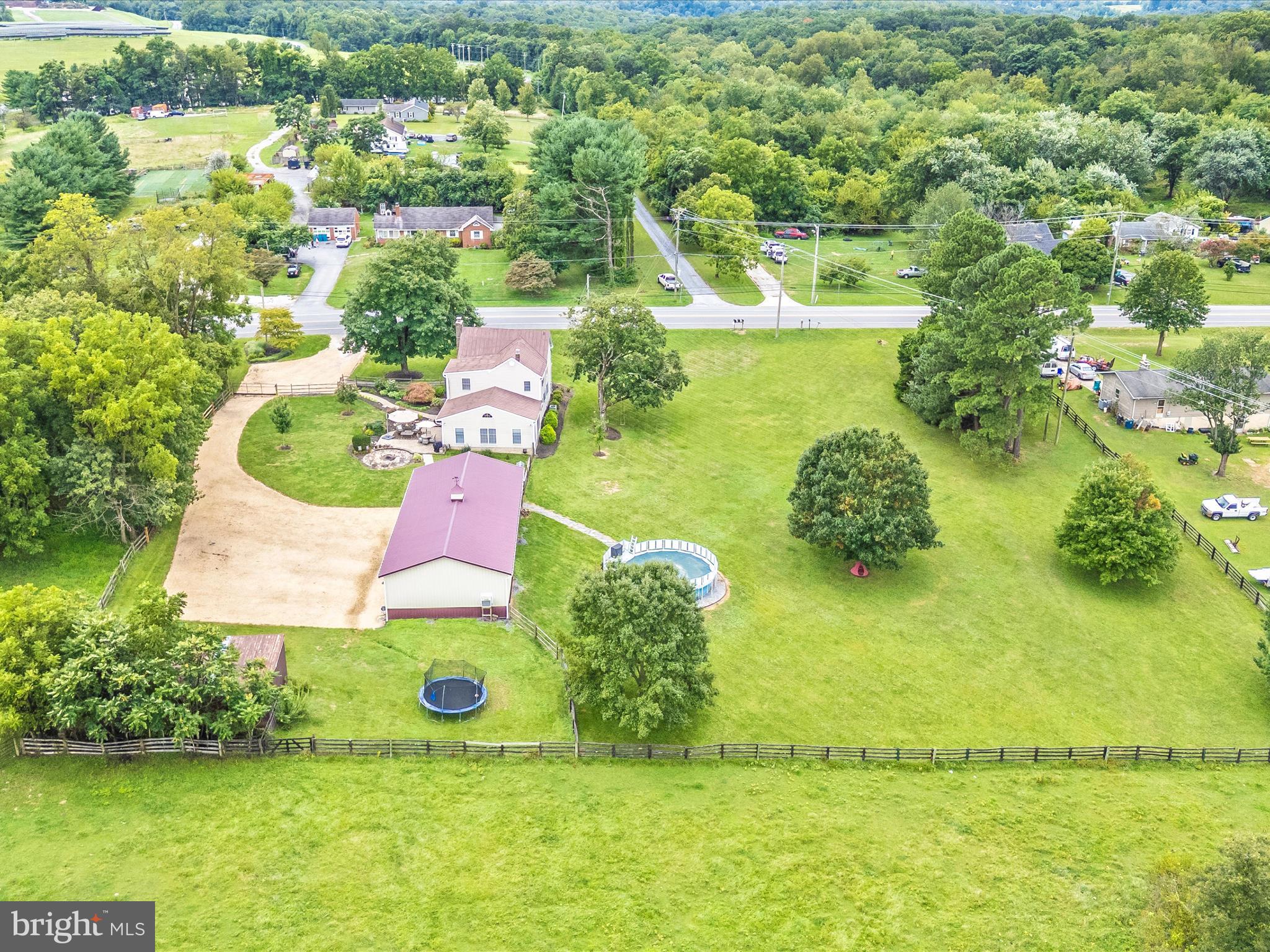 9000 Reichs Ford Road Frederick, MD 21704 - Photo 1 of 44 an aerial view of a house with a yard and lake view