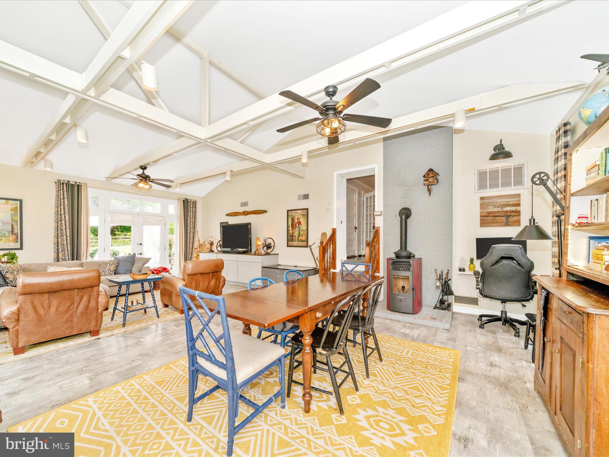 9000 Reichs Ford Road Frederick, MD 21704 - Photo 24 of 44 a view of a dining room and livingroom with furniture wooden floor and a rug