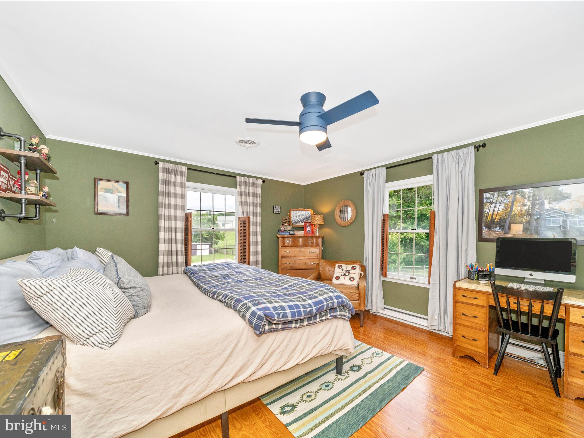 9000 Reichs Ford Road Frederick, MD 21704 - Photo 33 of 44 a bedroom with a bed a table and a window