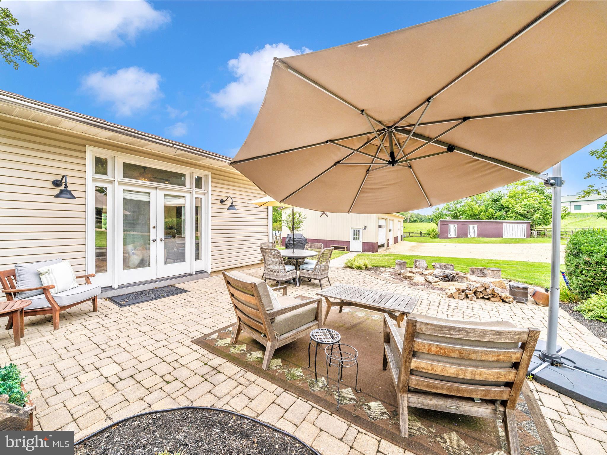 9000 Reichs Ford Road Frederick, MD 21704 - Photo 8 of 44 a view of a patio with a table and chairs under an umbrella