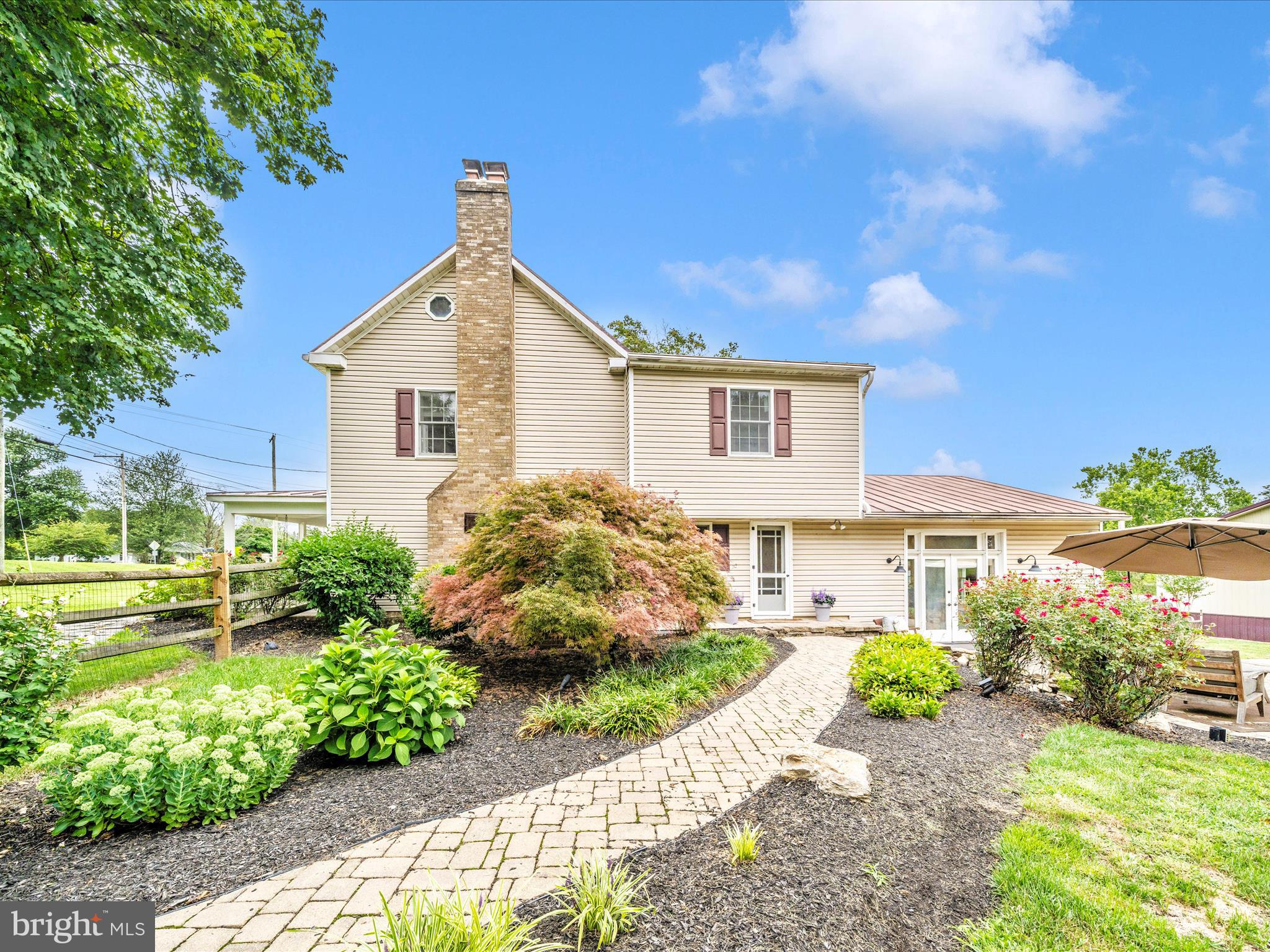 9000 Reichs Ford Road Frederick, MD 21704 - Photo 9 of 44 a front view of a house with a yard