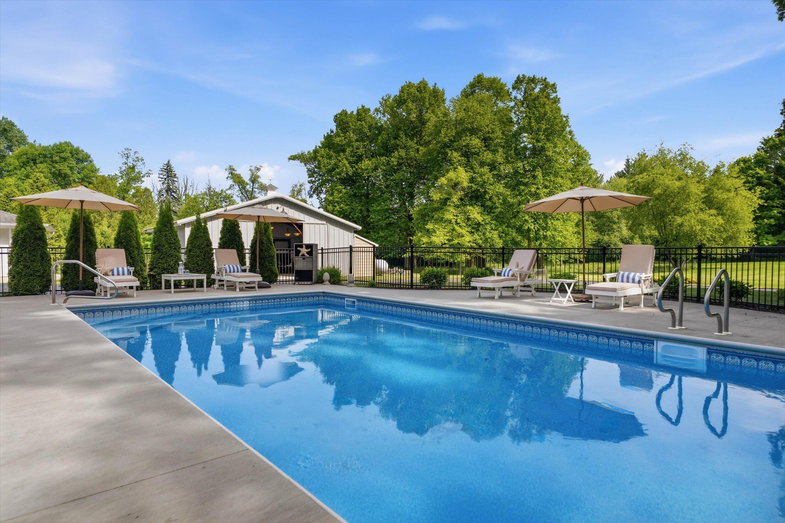 9431 Hawthorne Road Mequon, WI 53097 - Photo 46 of 67 Beautiful tiled inground pool