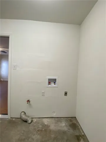 an empty room with wooden floor