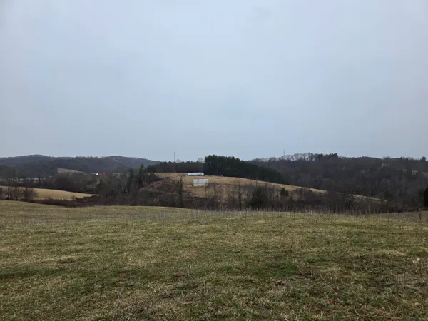 a view of an ocean and mountains