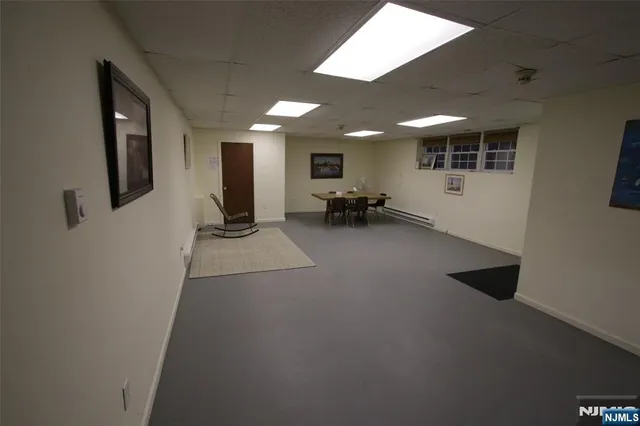 a view of a hallway with seating area