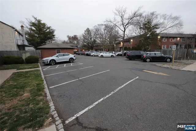 a view of street with parked cars