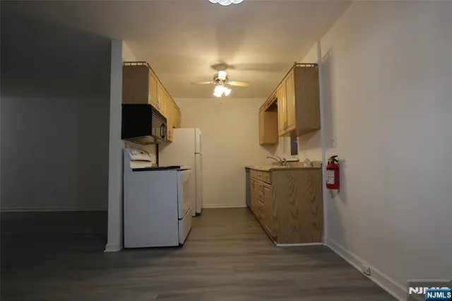 a view of a kitchen from the hallway