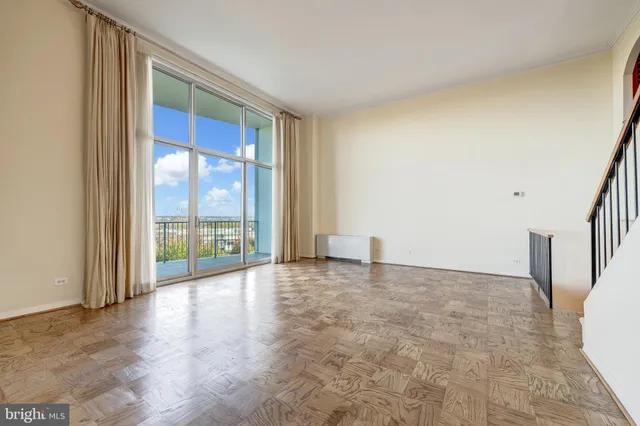 a view of empty room with windows