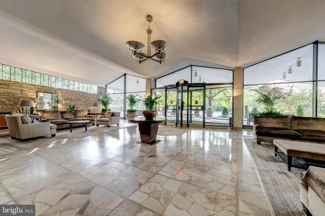a view of an empty room with glass door