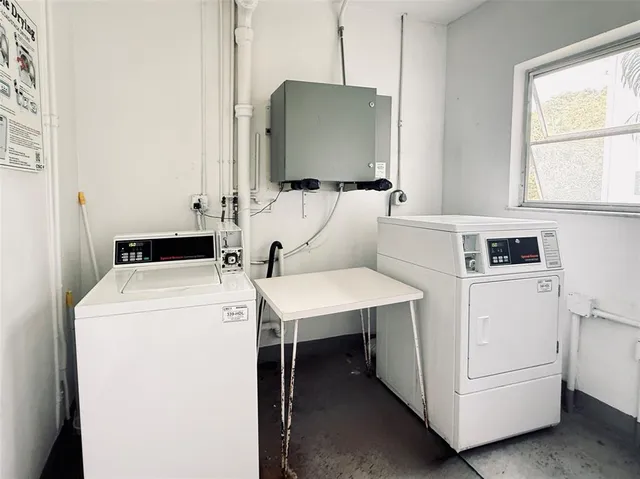 a utility room with dryer and washer
