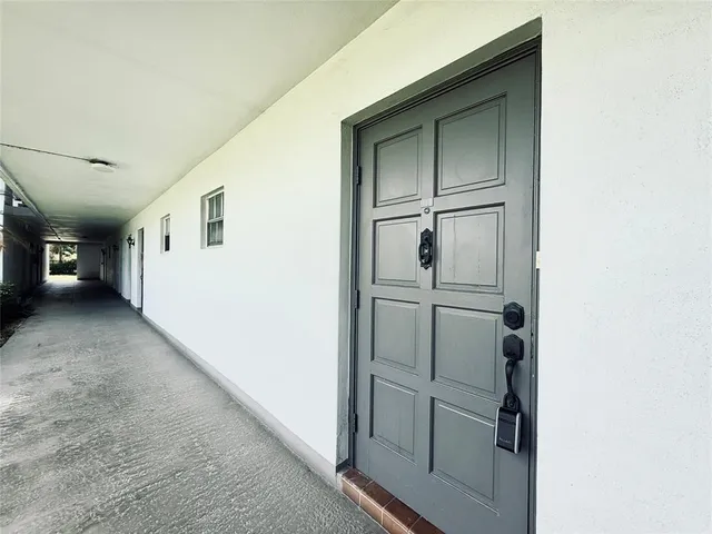 a view of a hallway with white walls