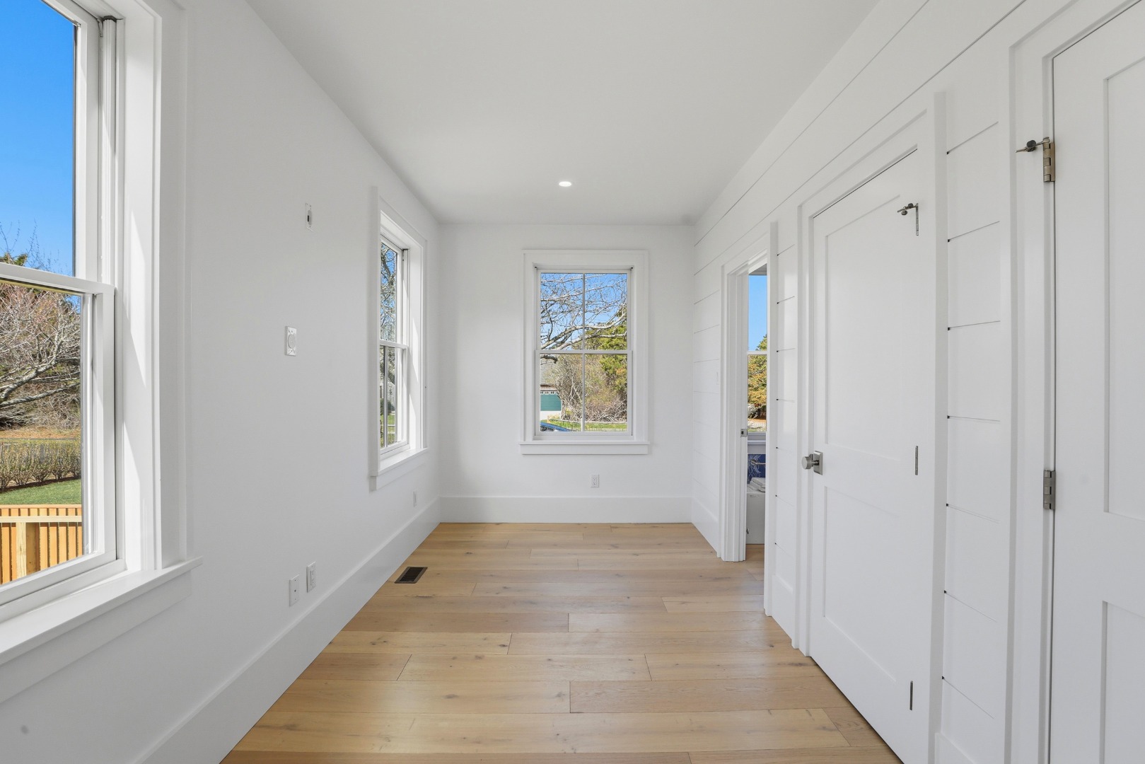 10 Rudder Lane Nantucket, MA 02554 - Photo 13 of 33 a view of a hallway with wooden floor and windows