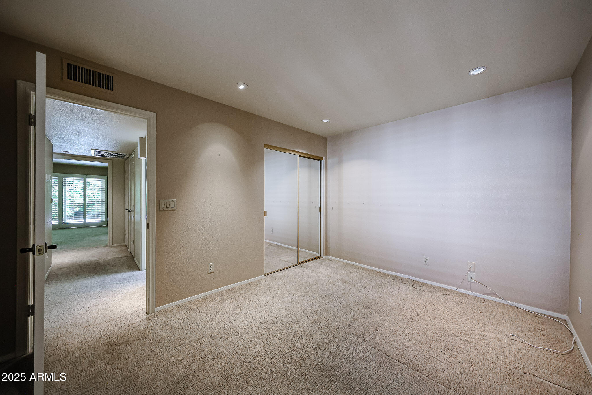 7834 East Ocotillo Road Scottsdale, AZ 85250 - Photo 11 of 47 an empty room with closet and a bathroom