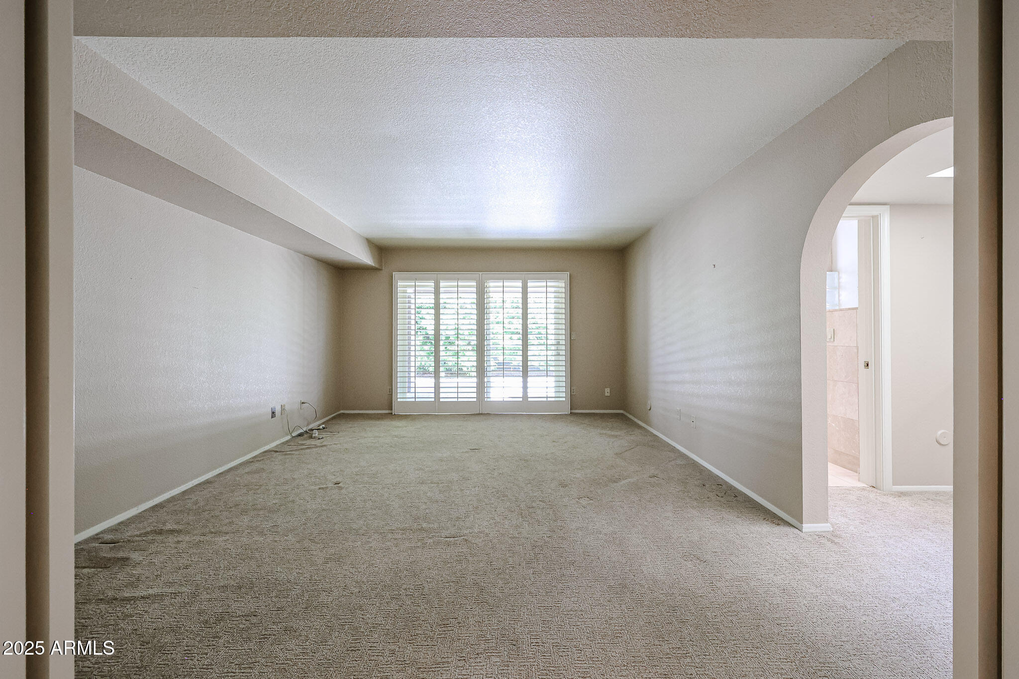 7834 East Ocotillo Road Scottsdale, AZ 85250 - Photo 16 of 47 an empty room with windows