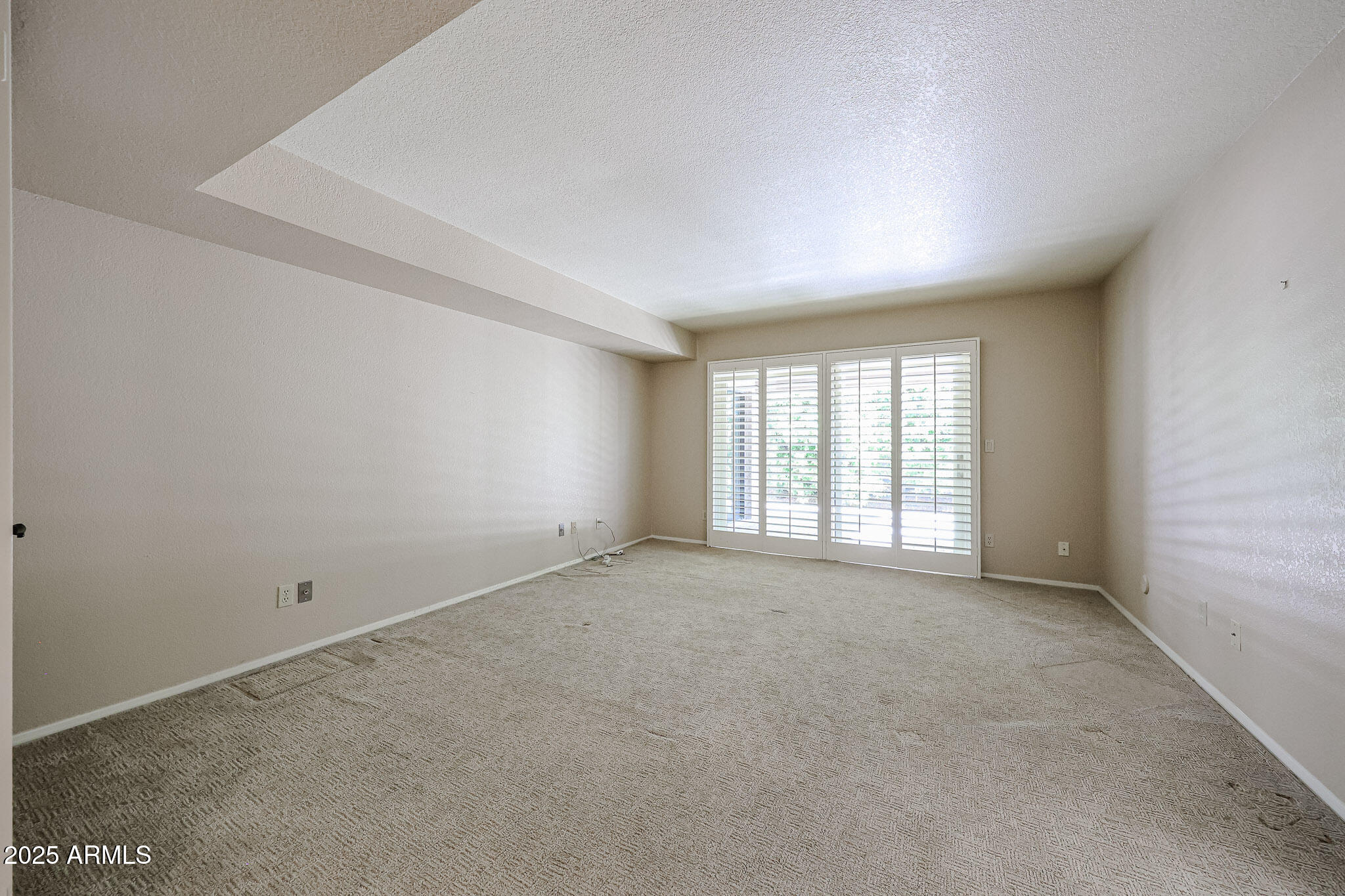 7834 East Ocotillo Road Scottsdale, AZ 85250 - Photo 17 of 47 an empty room with windows