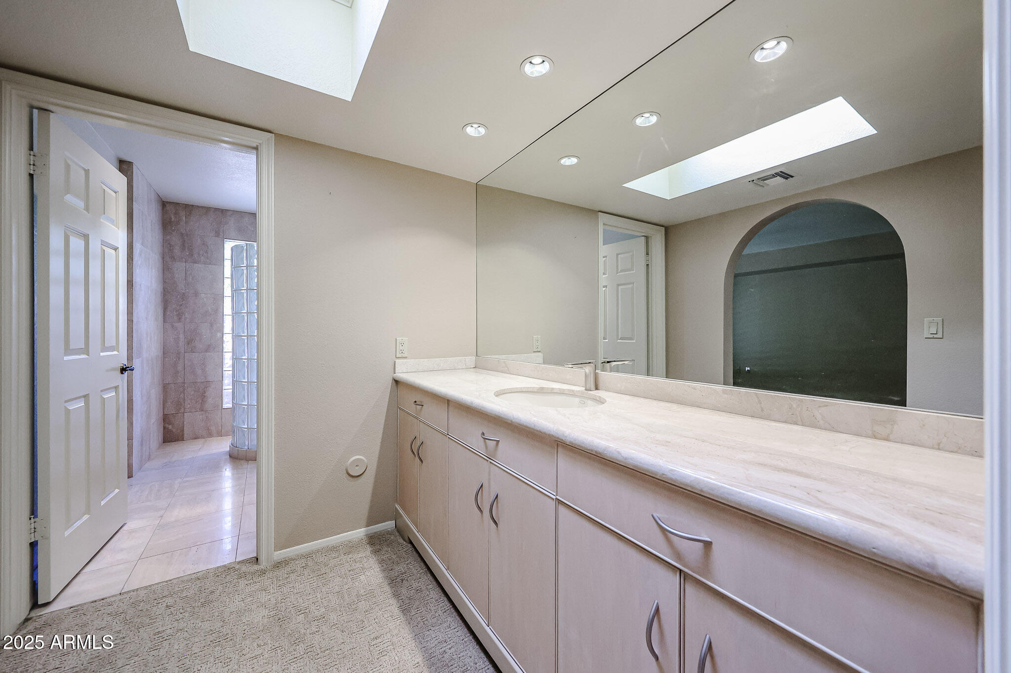 7834 East Ocotillo Road Scottsdale, AZ 85250 - Photo 21 of 47 a bathroom with a sink and a mirror