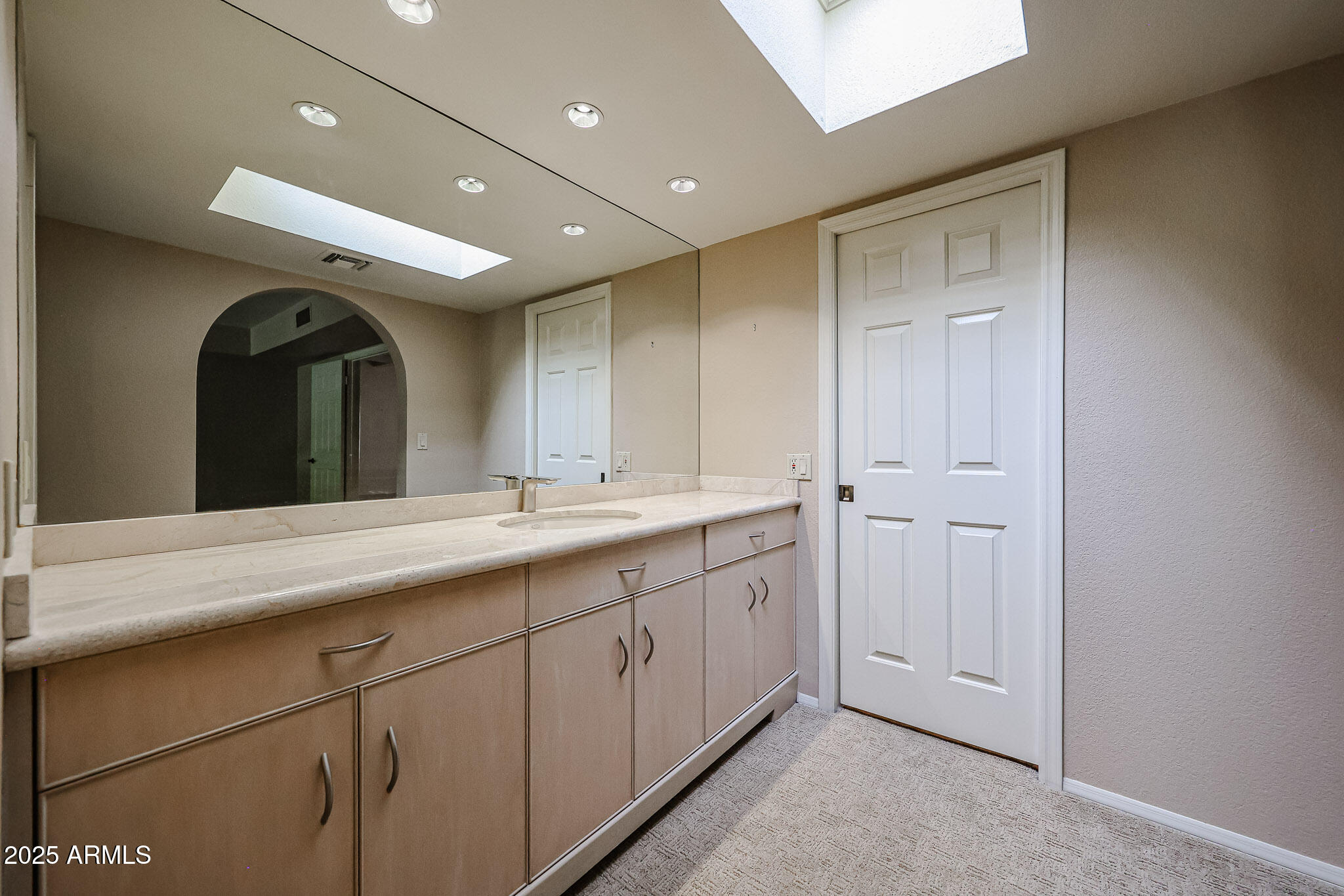 7834 East Ocotillo Road Scottsdale, AZ 85250 - Photo 23 of 47 a spacious bathroom with a double vanity sink and a mirror