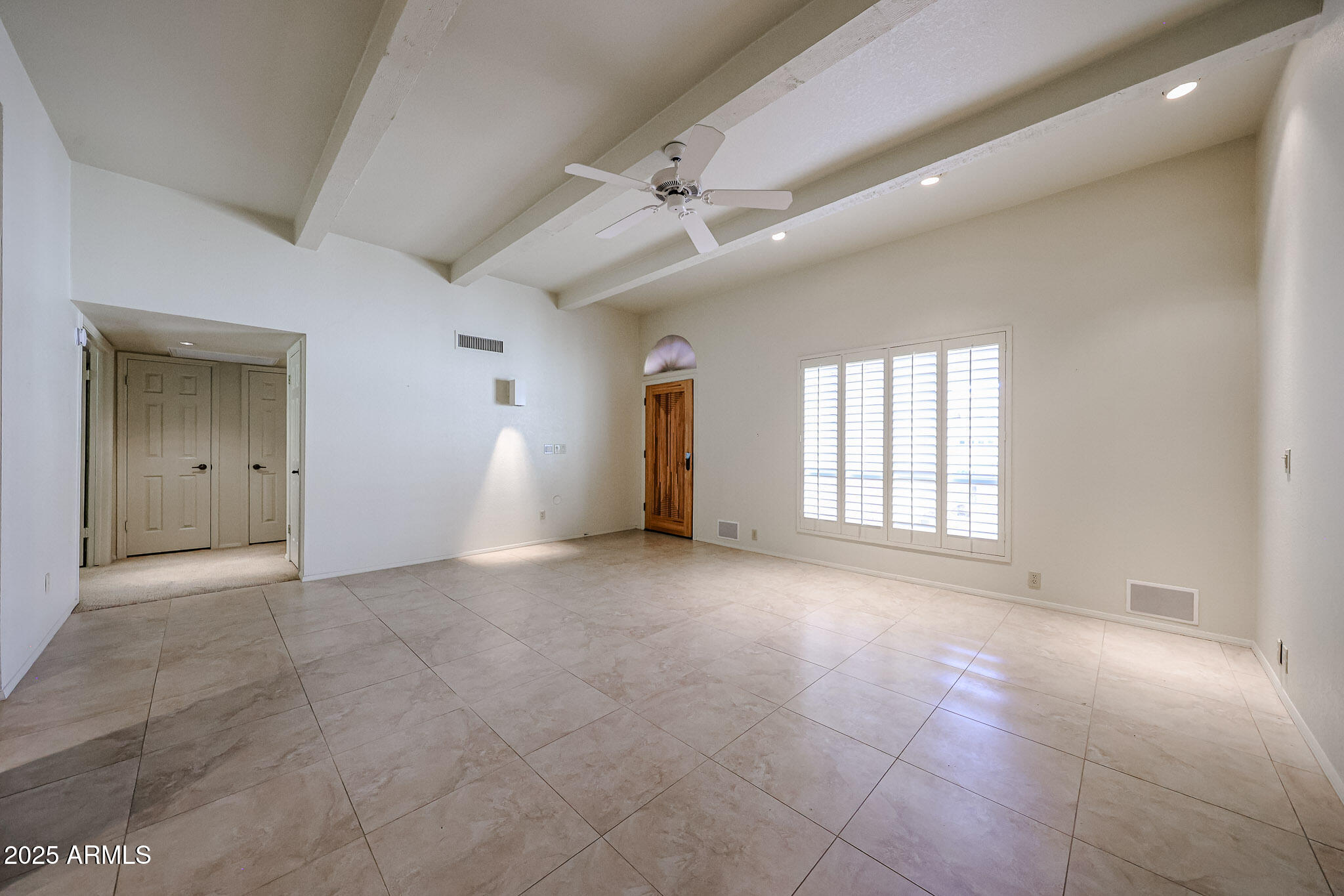 7834 East Ocotillo Road Scottsdale, AZ 85250 - Photo 29 of 47 a view of an empty room with a window