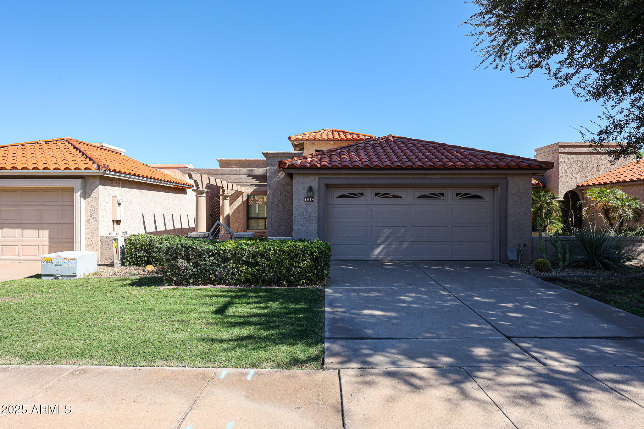 7834 East Ocotillo Road Scottsdale, AZ 85250 - Photo 3 of 47 a front view of a house with a yard
