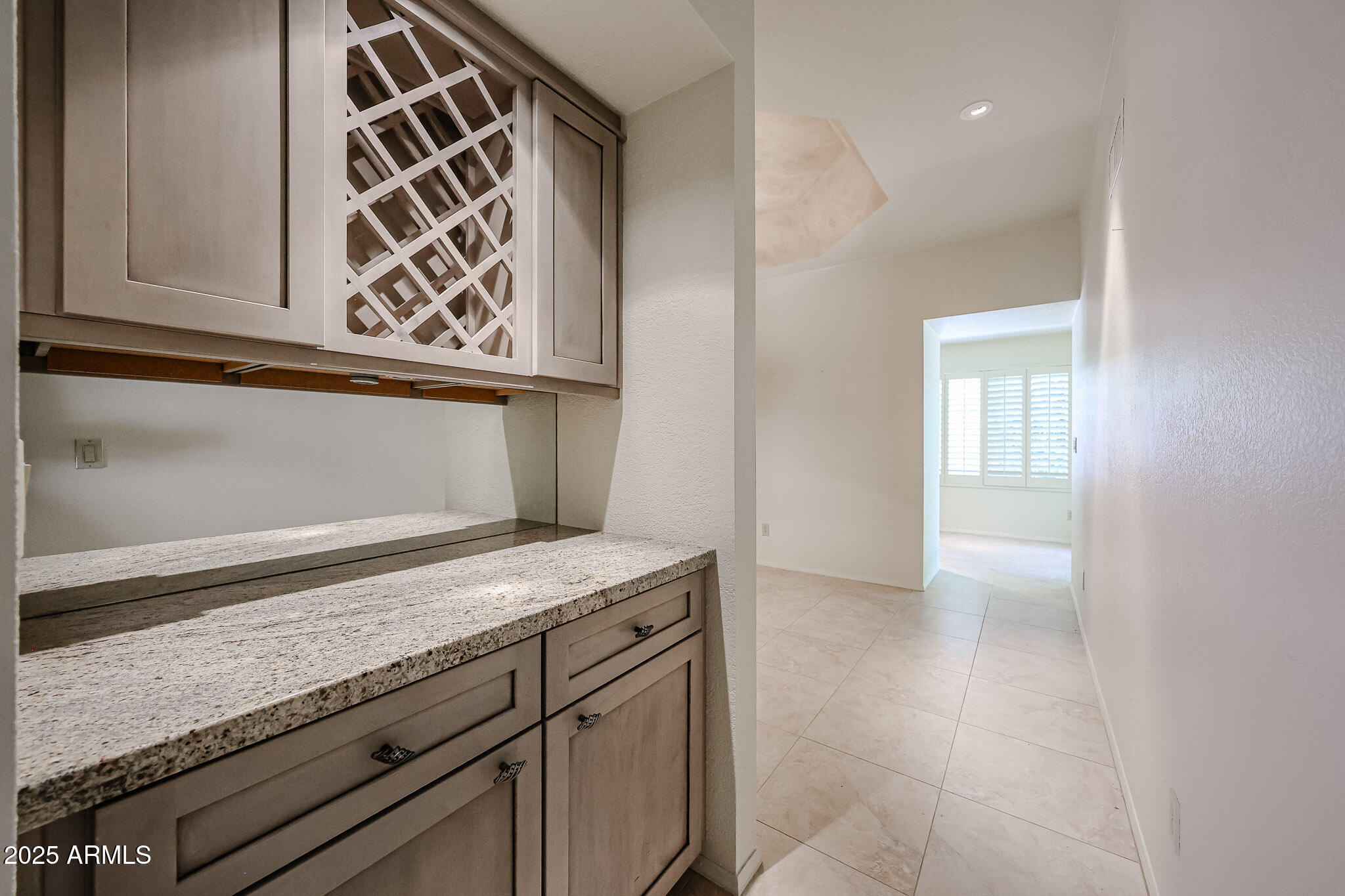 7834 East Ocotillo Road Scottsdale, AZ 85250 - Photo 32 of 47 a view of kitchen island with wooden floor