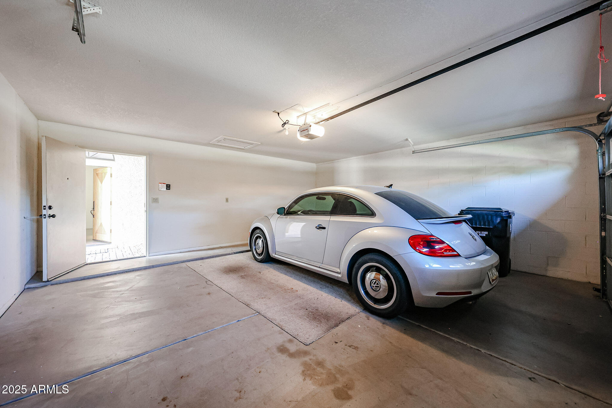 7834 East Ocotillo Road Scottsdale, AZ 85250 - Photo 38 of 47 a view of a car in garage