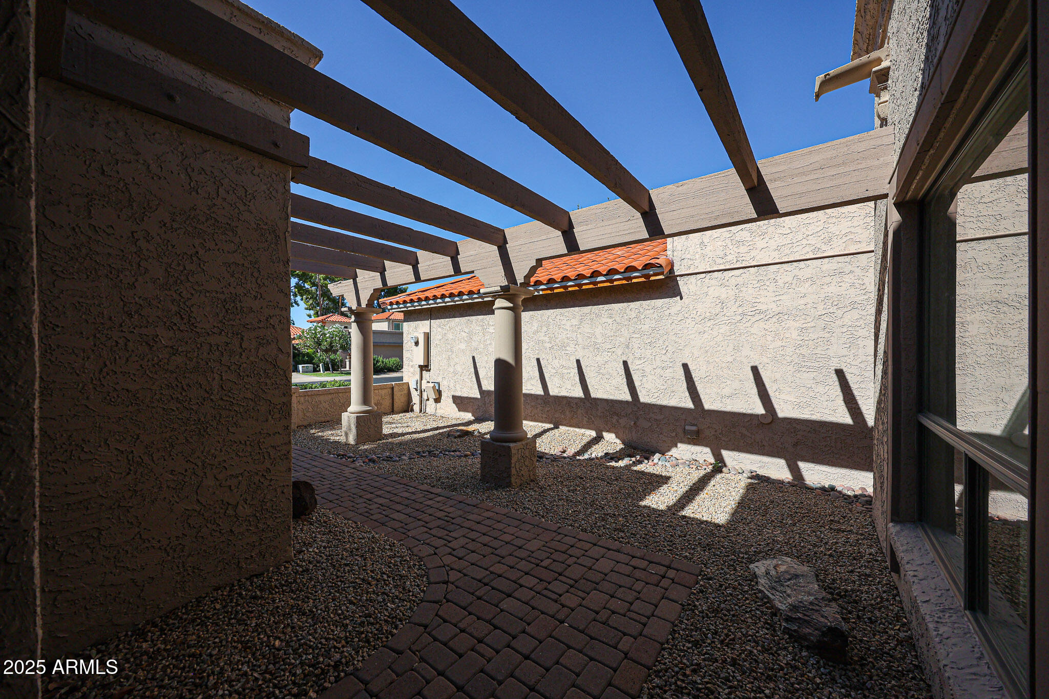 7834 East Ocotillo Road Scottsdale, AZ 85250 - Photo 40 of 47 a view of a porch with seating space