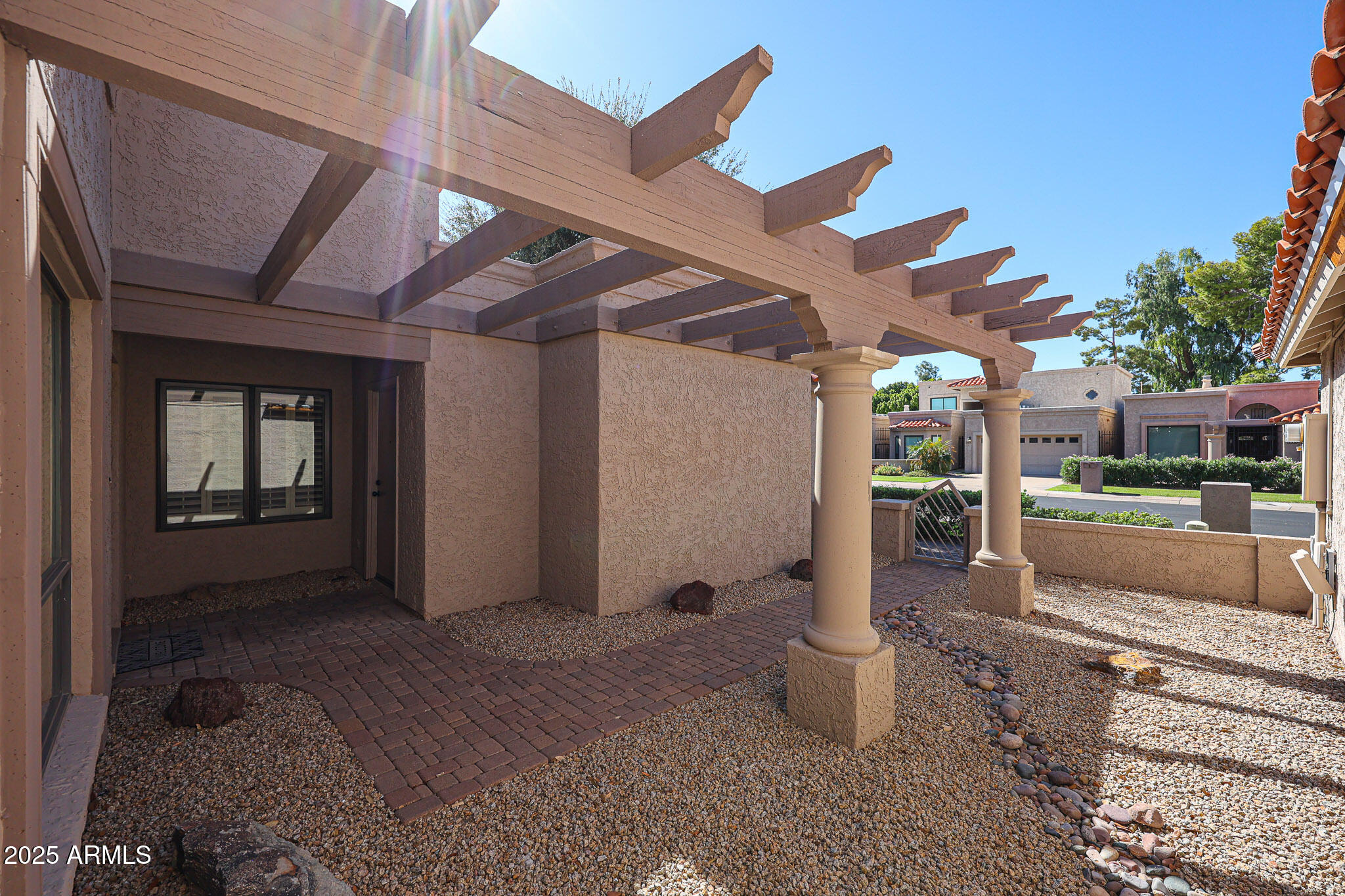 7834 East Ocotillo Road Scottsdale, AZ 85250 - Photo 41 of 47 a view of a porch with plants and backyard