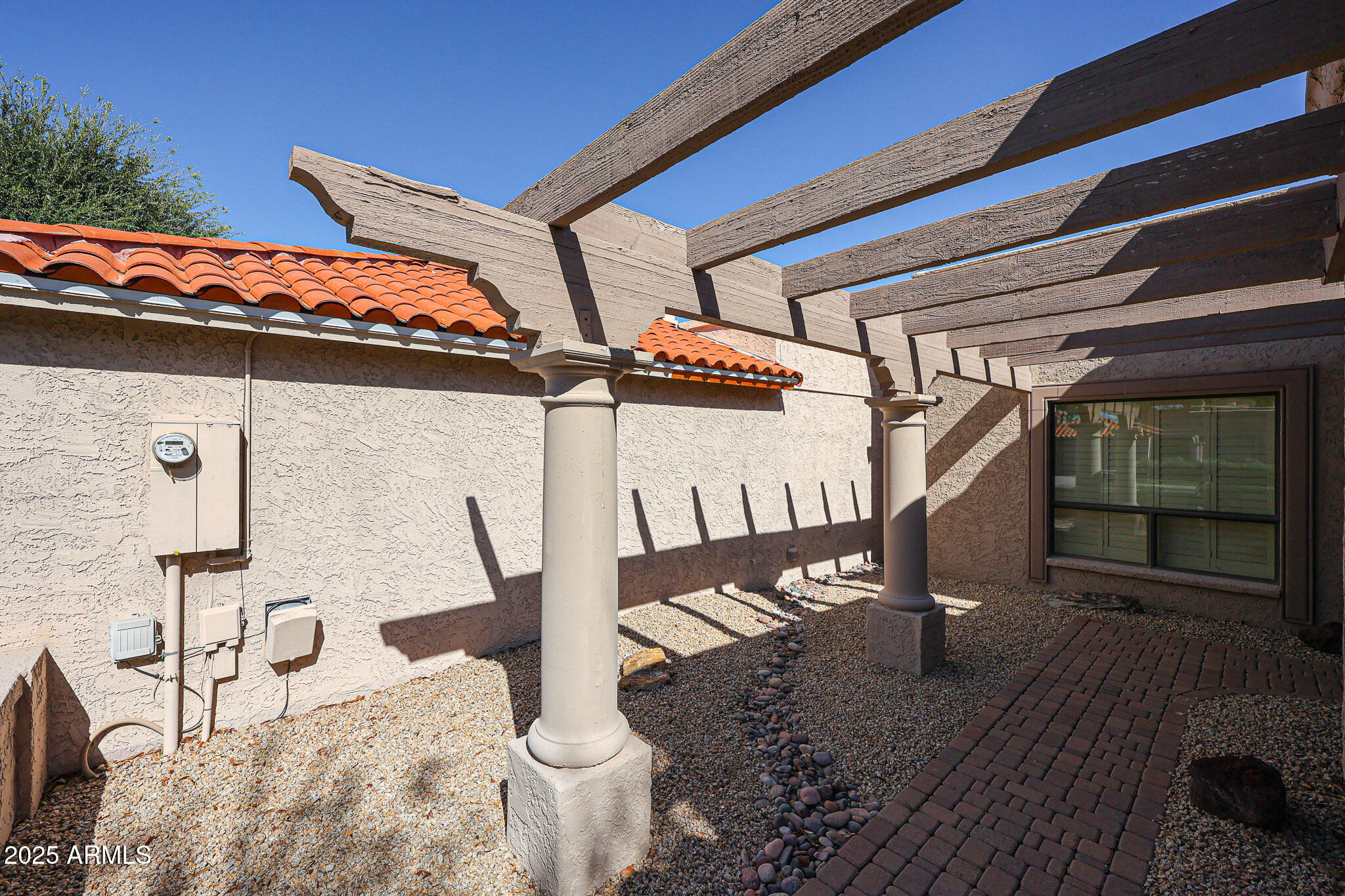 7834 East Ocotillo Road Scottsdale, AZ 85250 - Photo 42 of 47 a view of a porch with a table and chairs