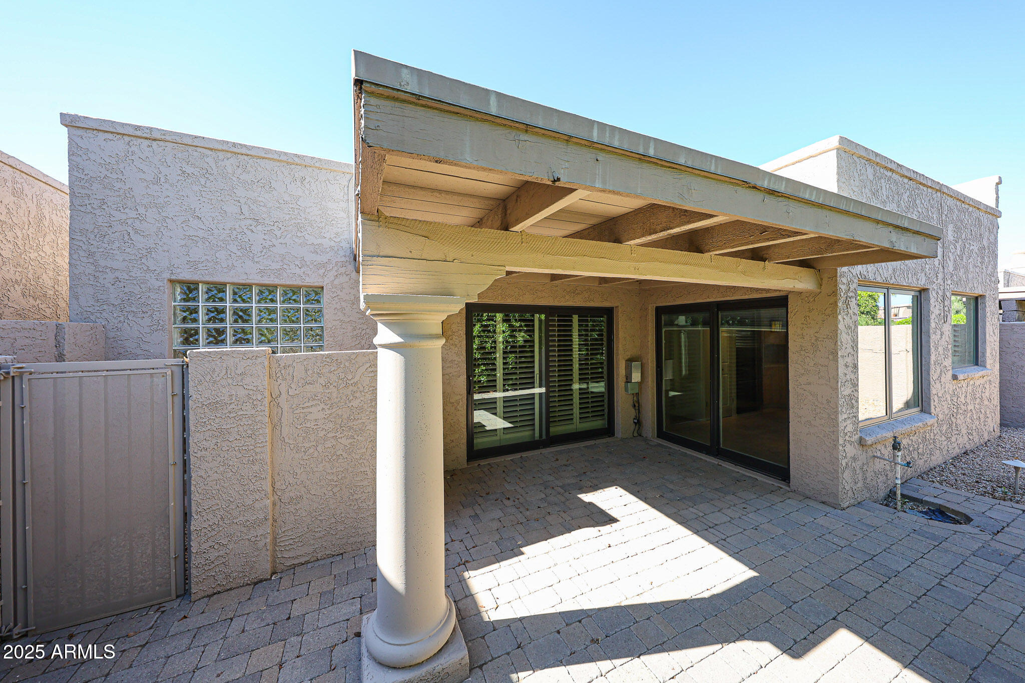 7834 East Ocotillo Road Scottsdale, AZ 85250 - Photo 45 of 47 a view of a brick house with large windows