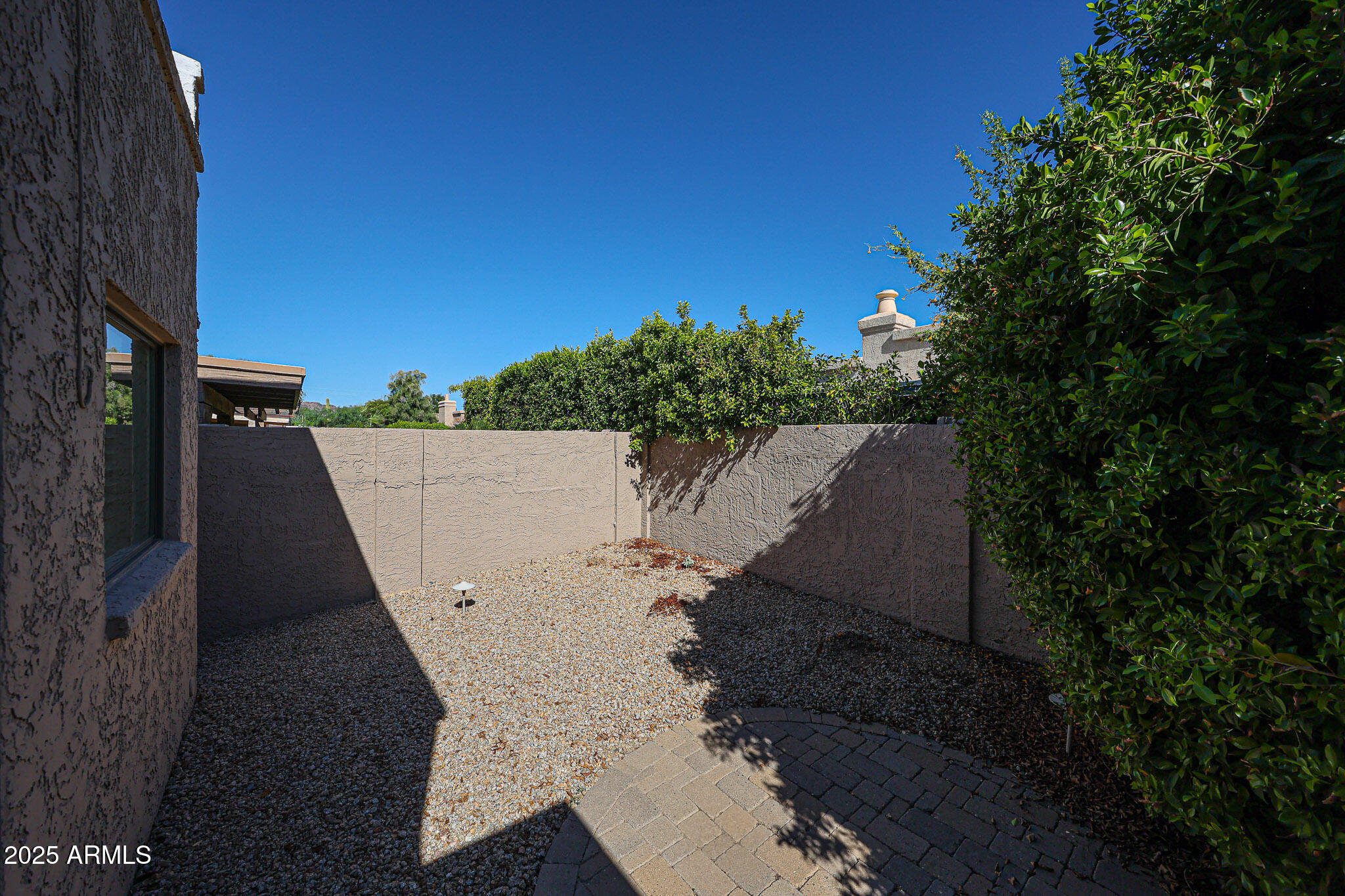 7834 East Ocotillo Road Scottsdale, AZ 85250 - Photo 47 of 47 a view of a house with a yard