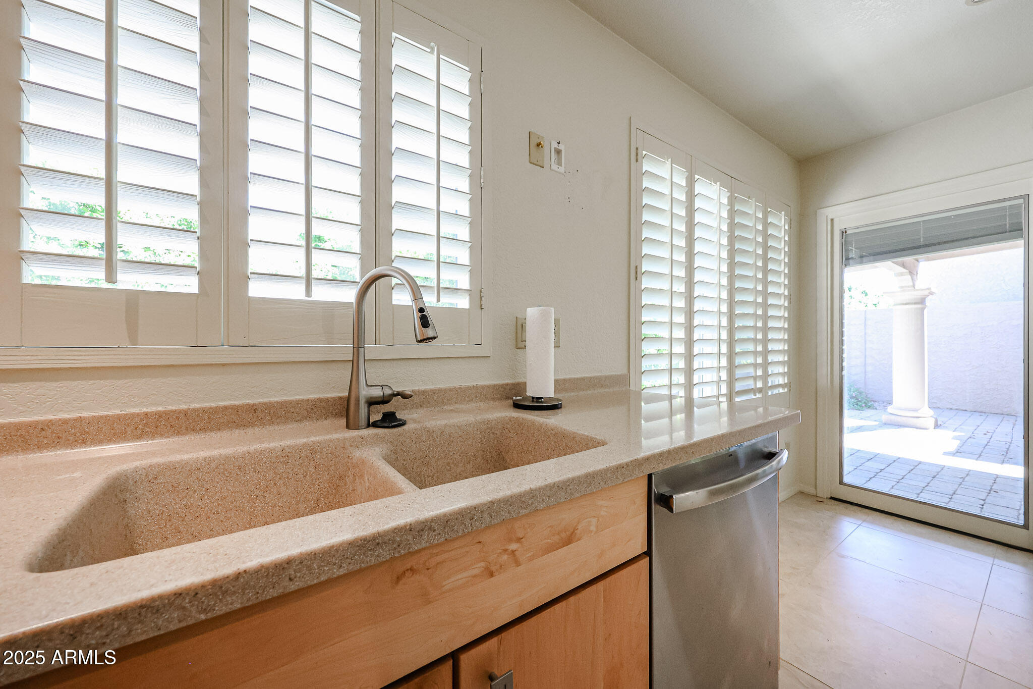 7834 East Ocotillo Road Scottsdale, AZ 85250 - Photo 8 of 47 a kitchen with a sink and large window