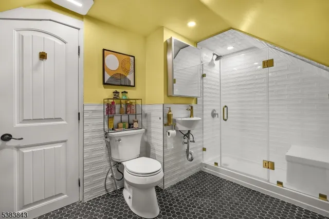 a bathroom with a toilet sink and shower
