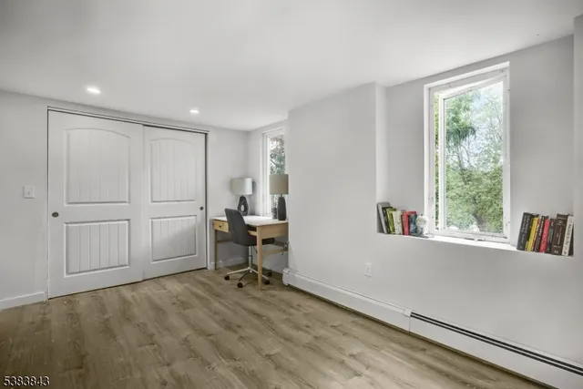 a view of a livingroom with an empty space and a window