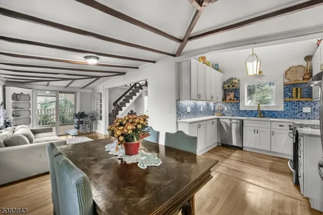 a kitchen with stainless steel appliances granite countertop a sink and cabinets